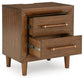 Lyncott King Upholstered Bed with Mirrored Dresser and Nightstand