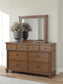 Chadworth California King Poster Bed with Mirrored Dresser
